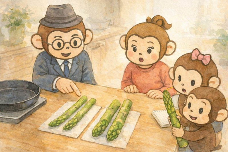 おサルの家族が、アスパラの太さ比較をしているシーン